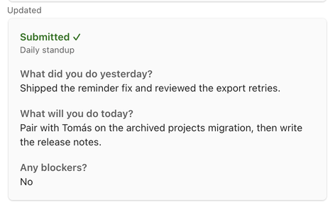 The card after submitting: a green Submitted heading, the standup name, and the three answers.